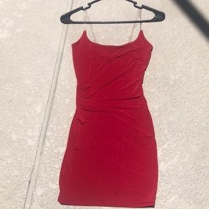 Ruby red cocktail dress with clear straps.